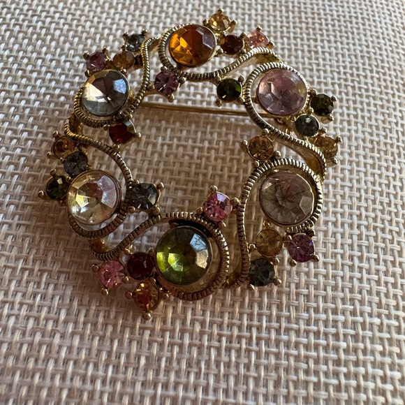Monet Jewelry - Gorgeous signed Monet multi colored jewel on open wreath goldtone